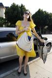 Angelina Jolie shows cleavage with yellow dress at restaurant in Hollywood